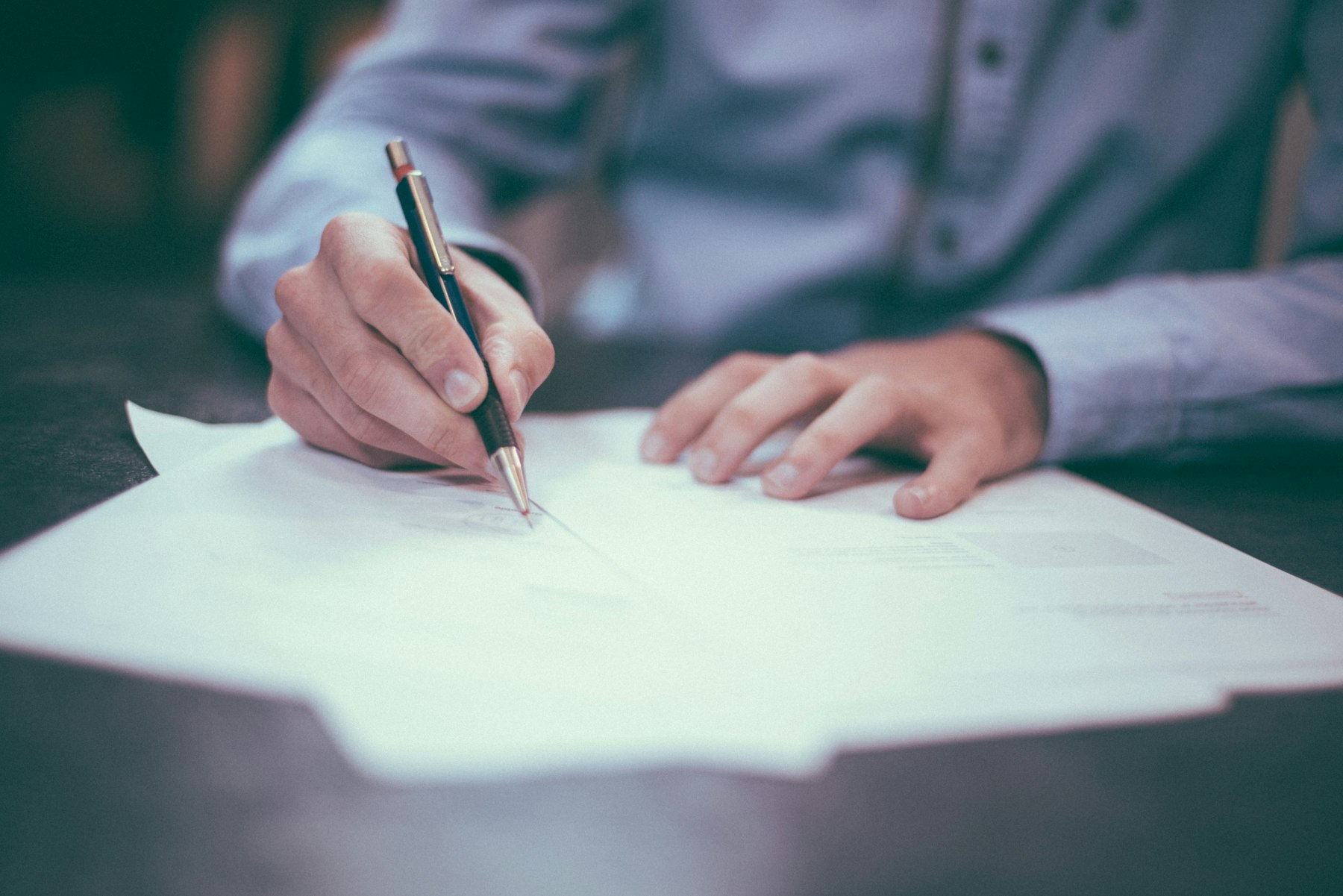 Person signing a vehicle lease contract